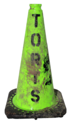 mud-splattered safety cone stenciled with TORTS